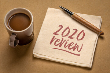 2020 year review - handwriting on a napkin with a cup of coffee, end of year business concept