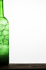 Bubbles in a green bottle on a white background