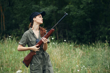 Military woman guns in hand black cap travel hunting weapons 