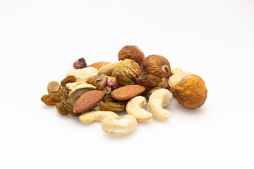 A variety of nuts  are placed on the white background at the center of the image, top view, flay lay,top-down.