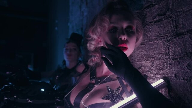 Fantastic video of sexy cyber raver girls filmed in fluorescent clothing under UV black light. Club party glamor style. Creative art