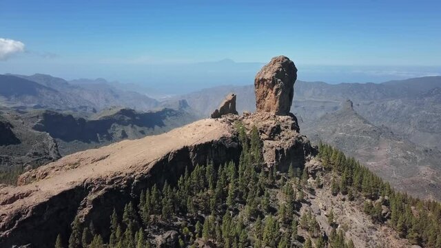 Flight over of Roque Nublo, a volcanic rock in caldera of Tejeda, Gran Canaria, Canary islands, Spain.
