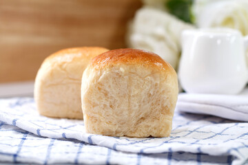 Fresh home made bread on white table background with napkin