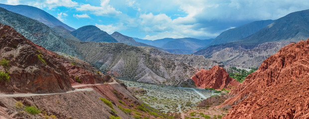 Panoramic stock photo of the colored hills and mountains in Purmamarca village , Jujuy, Argentina. Landscape