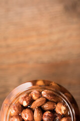 Almonds with honey in a glass jar