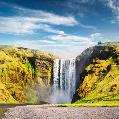 Incredible view on famous Skogafoss waterfall on Skoga river. Iceland, Europe. Landscape photography