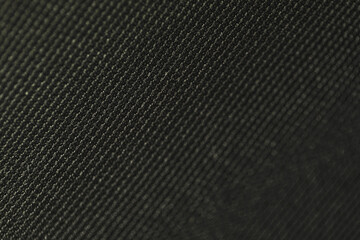 Black synthetic fabric with shallow depth of field