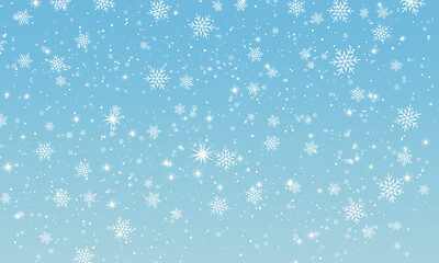 Snow background. Winter snowfall. White snowflakes on blue sky. Christmas background. Falling snow.