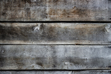 Detailed texture of an old weathered brown wooden planks. Background image, close up.