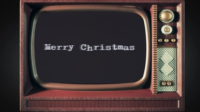 Inside a toy tv: a scary text, Merry Christmas, appearing on the screen, with a light behind the typewriter font, typical of a horror flick (b-movie).
