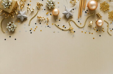 Christmas background . New Year decorations in gold colors on gold background. Top view. copy space