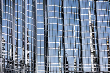 Fototapeta na wymiar Reflections on a building made out of glass