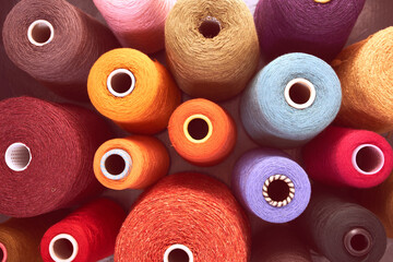 Composition of colorful vibrant wool threads from above. Autumn colours