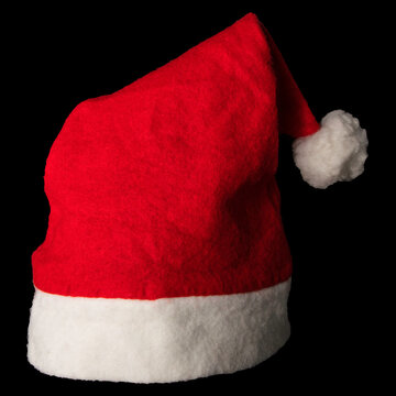 Cappello di Babbo Natale fotografato su sfondo nero. Stock Photo | Adobe  Stock