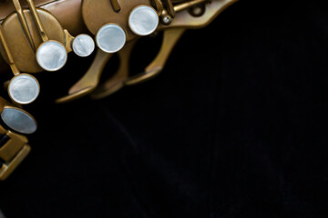 Vintage saxophone on a black background