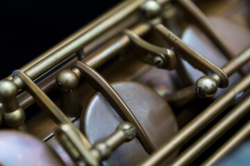 Fototapeta premium Vintage saxophone on a black background