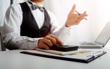 businesswoman hand using smart phone, tablet payments and holding credit card online shopping, omni channel, digital tablet docking keyboard computer at office in sun light