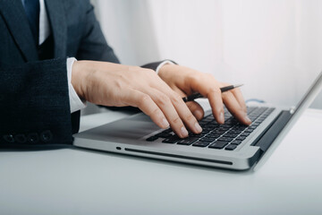businesswoman hand using smart phone,mobile p payments online shopping,omni channel,digital tablet docking keyboard computer at office in sun light