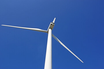 wind turbine against a blue sky	