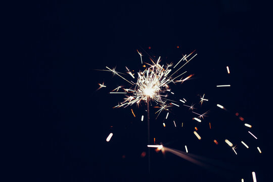 Sparkler overlay against black background. Festive, new years eve image. 