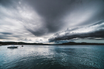 Naklejka premium Colorful storm over Adrait Sea, beautiful clouds and stormy landscape in the summer