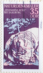 GERMANY, DDR - CIRCA 1977 : a postage stamp from Germany, GDR showing the natural monument: stone rose; near Saalburg