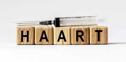Text HAART made from wooden cubes. White background