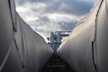 Daylight. Metal pipes covered with a special insulation to reduce heat loss. heating main.