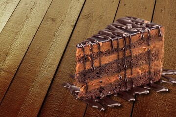 Delicious chocolate cake with chocolate cream on desk