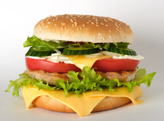 hamburger with meat, cheese, salad and vegetables