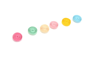 Assorted quilling paper circles, on white