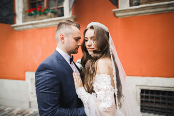 Romantic wedding moment, couple of newlyweds smiling portrait, bride and groom hugging