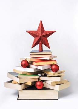 Christmas concept background. Books in the form of a christmas tree