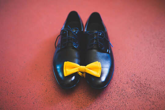 Grooms Shoes With A Yellow Bowtie