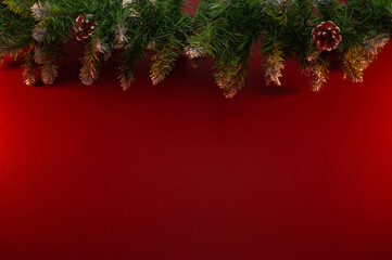 Fototapeta na wymiar Christmas garland on a red wall background