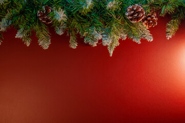 Christmas garland on a red wall background