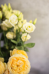 bunch of  yellow roses on gray background
