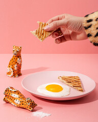 Breakfast made of coffee, eggs, bread and a tiger