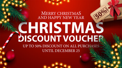 Christmas discount voucher, up to 50 off on all purchases. Red discount voucher with presents, Christmas tree branches, candy canes and Christmas balls