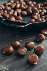 chestnut on dark wooden table