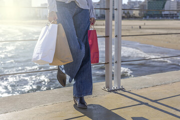 Unrecognizable woman carrying take away food bag