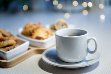 Coffee with cookies isolated on a white table.