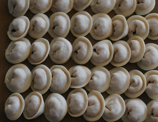Cooking dumplings, ravioli on the table