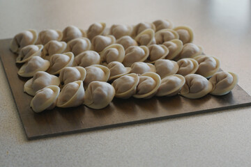 Cooking dumplings, ravioli on the table
