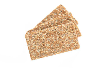Stack of wholegrain dry crispy bread with sesame isolated on a white background in close-up