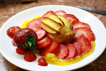 Delicious creamy Eclair with strawberries.