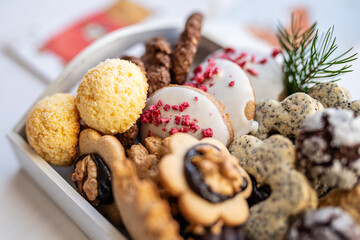 Close up of christmas cakes and cookies with santa hat 