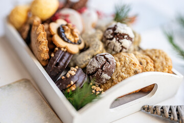 Close up of christmas cakes and cookies with santa hat 