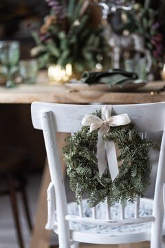 Festive Table Setting For The New Year And Christmas. Beautiful Decorations, Dishes, Candles. Quiet Family Dinner During Self-isolation Due To Covid.