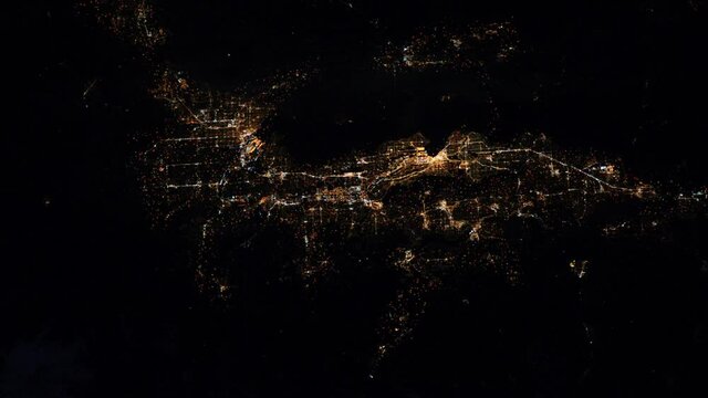 Flying over Seattle city night lights satellite aerial view flashing lights animation. Images furnished by Nasa